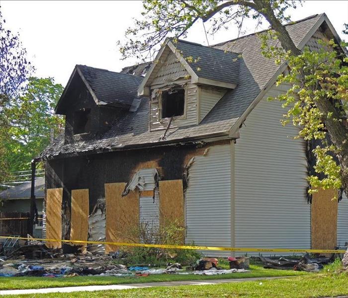 A house with exterior fire damage.